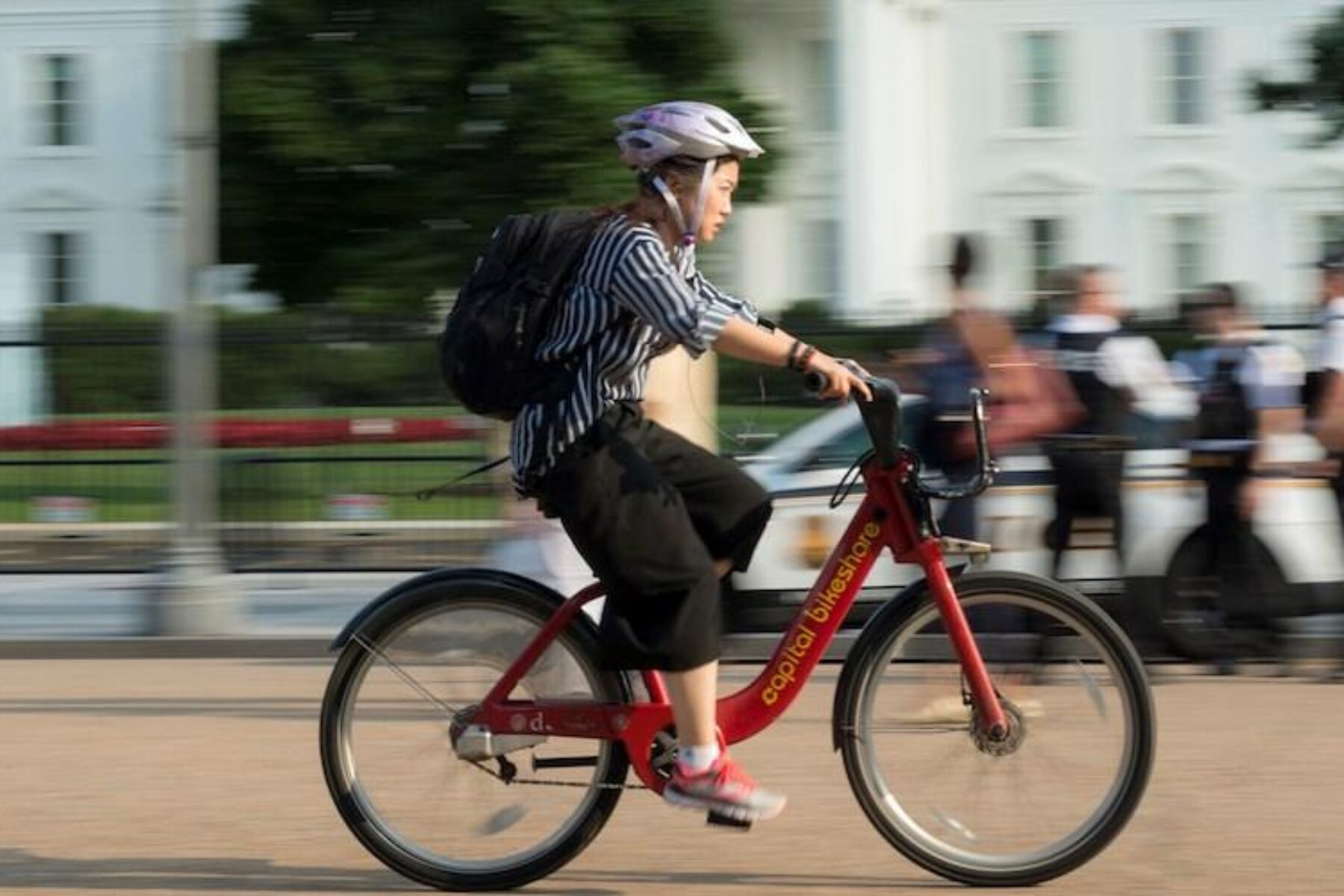 Bicyclist in front of the White House | Photo courtesy Getty Images
