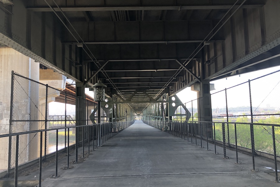 The Woodswether Bridge allows for pedestrian and bicycle crossings over the Kansas River. The bridge, which is adorned with local artwork, serves as a crucial link on the 15-mile Riverfront Heritage Trail. | Photo by Cindy Barks
