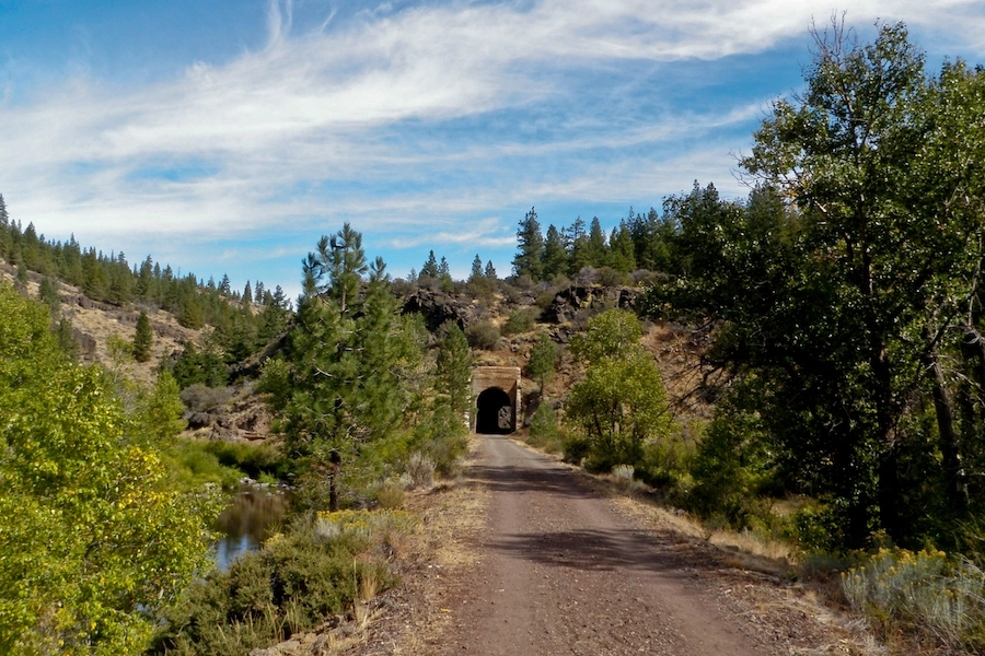 The Bizz Johnson Trail winds 25 miles through the dense woodlands of Northern California’s high country and the rugged beauty of the Susan River Canyon, traversing historical tunnels and trestles along the way. Photo by Michael McCullough.