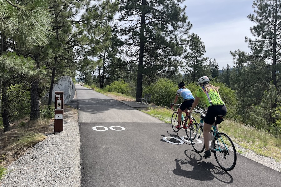 Riders pass the Washington/Idaho state line into Idaho, where the trail becomes the North Idaho Centennial Trail and continues on toward Coeur d&rsquo;Alene, Idaho, and to the east. Photo by Cindy Barks