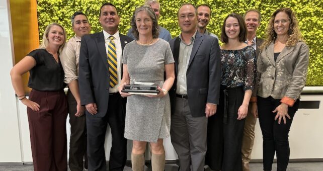 Clark at her October induction and (right) with Rails to Trails Conservancy staff and colleagues | Joe LaCroix, courtesy Rails to Trails Conservancy