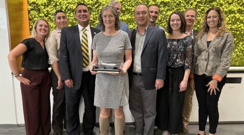 Clark at her October induction and (right) with Rails to Trails Conservancy staff and colleagues | Joe LaCroix, courtesy Rails to Trails Conservancy