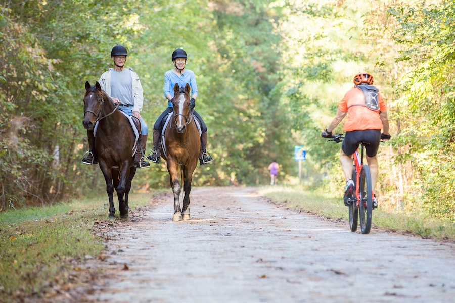 Horseback riders, bicyclist and runner on North Carolina's American Tobacco Trail | Photo courtesy Wake County Government