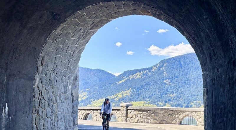 Bicyclist at Mitchell Point Tunnel along Oregon’s Historic Columbia River Highway State Trail | Photo by Glenn Zinkus