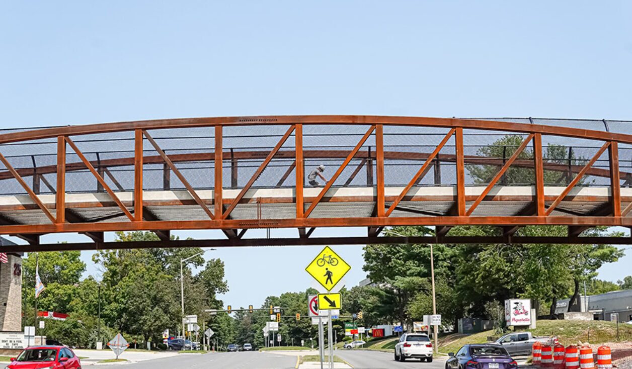 Opened in the summer of 2024, this 147-foot-long pedestrian bridge on the W&OD Trail provides safe crossings for people over busy Wiehle Avenue in Reston, Virginia. | Photo by Albert Ting