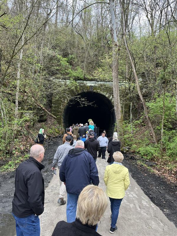 2025 Celebrate Trails Day event along Ohio's Hellbender Preserve and Trail, group walking toward tunnel | Photo by Eric Oberg