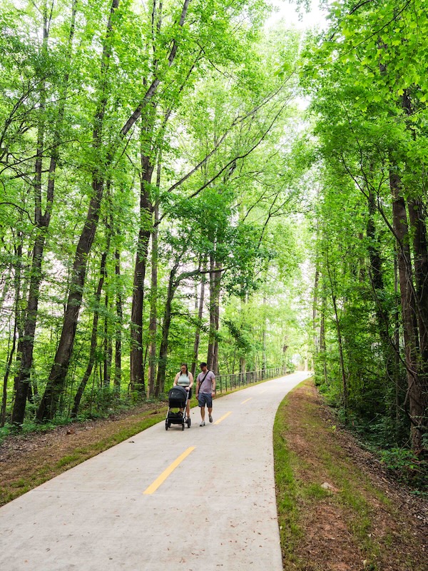 Walkers with baby carriage along Georgia's Woodall Rail Trail | Photo courtesy Upper Westside CID