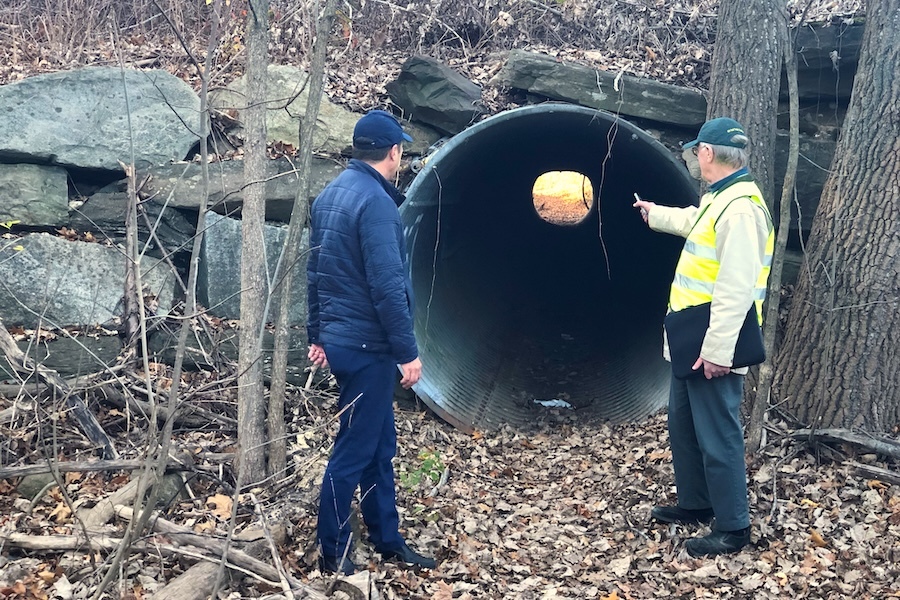 NH Rail Trails Coalitionโs Dave Topham with RTC President Ryan Chao at an old culvert in Derry that walkers and bicyclists use to cross the existing road that will become six lanes.