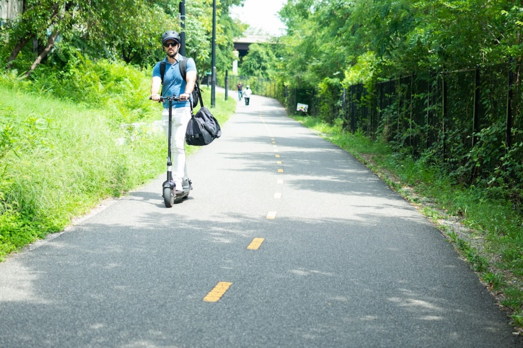Active transportation - E-scooter user on D.C.'s Metropolitan Branch Trail | Photo by India Kea