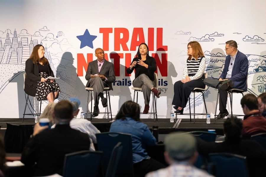 Joyce Pan Huang, Chief Impact Officer, Cleveland Foundation, speaking (center) on "Philanthropy’s Role in Powering Community Growth Through Trails" panel  | Photo by Dave Pelosi, Clum Creative