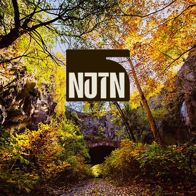Tile with North Jersey Trail Network's logo over New Jersey Bergen Arches | Photo by Bergen Arches Preservation Coalition
