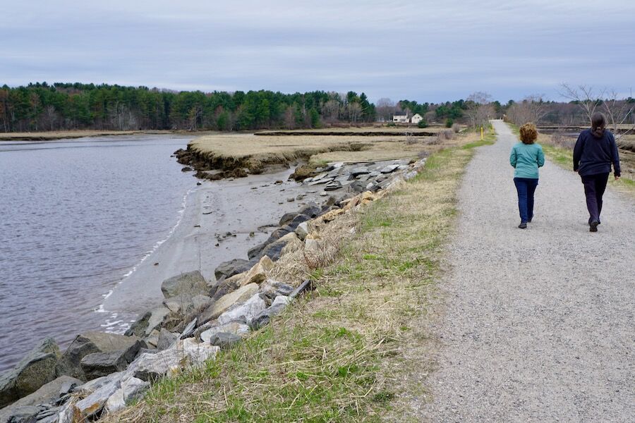 Carole Brush, executive director of the Eastern Trail Management District, left, and Nancy Borg, the Eastern Trail’s executive director, walk along a scenic stretch of trail through the Scarborough Marsh. Photo by Cindy Barks. Carole Brush, executive director of the Eastern Trail Management District, left, and Nancy Borg, the Eastern Trail’s executive director, walk along a scenic stretch of trail through the Scarborough Marsh. Photo by Cindy Barks.