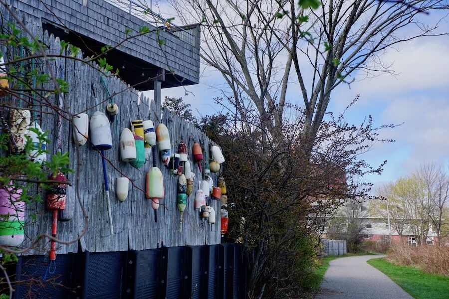 Old buoys decorate the walls along a portion of the Eastern Trail/South Portland Greenbelt. Sections of the greenbelt pathway follow the shores of Portland, Maine’s Casco Bay. Photo by Cindy Barks. Old buoys decorate the walls along a portion of the Eastern Trail/South Portland Greenbelt. Sections of the greenbelt pathway follow the shores of Portland, Maine’s Casco Bay. Photo by Cindy Barks.