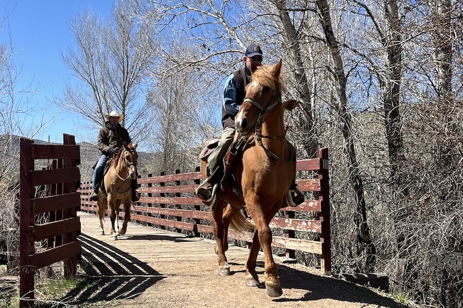 04_Utah's Historic Union Pacific Rail Trail in Wanship_Photo by Cindy Barks Equestrians on the trail cross the Weber River near the small town of Wanship. Horseback riders are welcome on the trail. Photo by Cindy Barks.