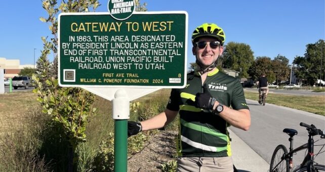 RTC's Kevin Belle at the First Ave Trail Great American Rail-Trail historical trail marker | Photo courtesy RTC