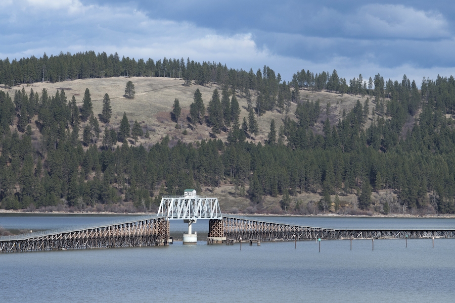 The Trail of the Coeur d'Alenes covers nearly 72 paved miles through scenic mountains and valleys in Idaho's Panhandle. Travelers skirt sparkling Lake Coeur d'Alene and cross it on the impressive Chatcolet Bridge. Photo by Lisa James.