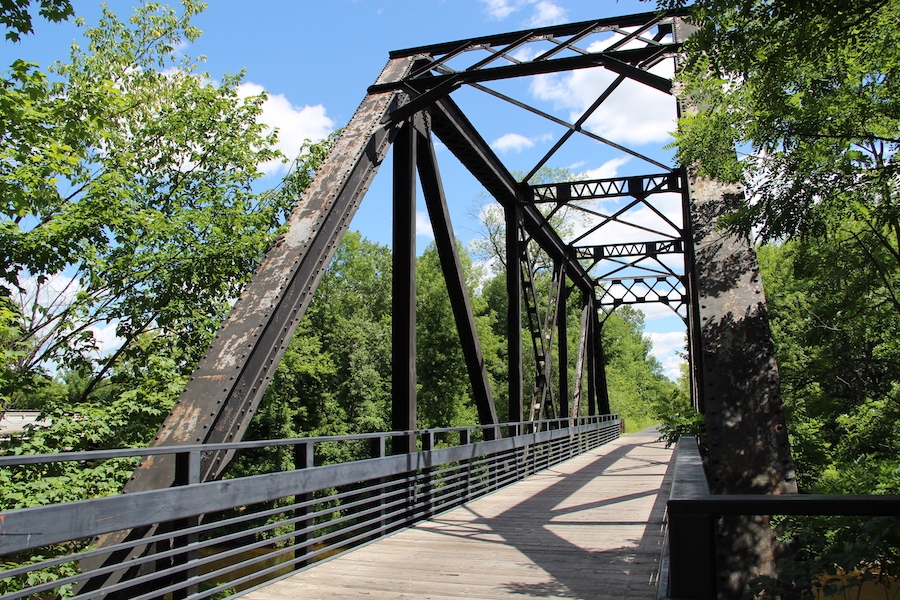 The Pere Marquette Rail-Trail traverses pastoral countryside and charming small towns over its 30 miles in central Michigan. Start at the Tridge, a unique bridge featuring three spokes spanning the confluence of the Chippewa and Tittabawassee Rivers. Photo by Craig Hanchey.