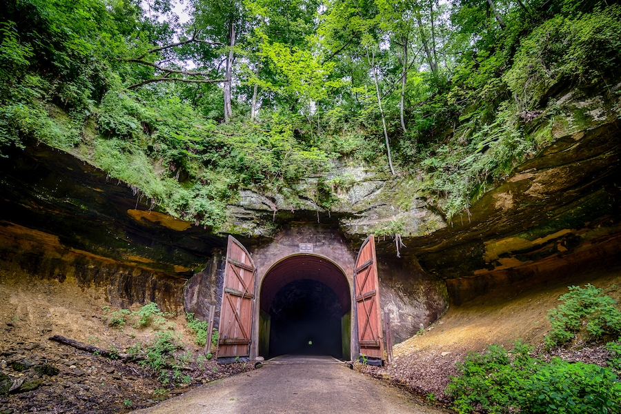 Set amid a Wisconsin landscape of rolling hills and farmland, the 32-mile Elroy-Sparta State Trail offers a relaxing ride. Highlights of the route are its three dramatic railroad tunnels that burrow deep through rock. Photo by Eric Reischl Photography.