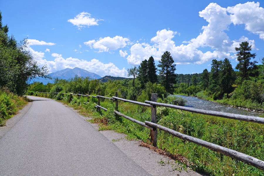 The windswept beauty of sage brush and scrub oaks, forests of ponderosa and spruce, verdant crops and ranchlands ringed in jagged mountains: The Rio Grande Trail traverses these Colorado landscapes along its 42-mile route. Photo courtesy Roaring Fork Transportation Authority.