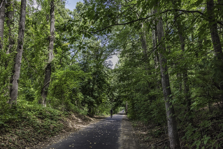 The 48-mile Farmington Canal Heritage Trail journeys through the heart of Connecticut, traversing lush forests and open farmland, connecting quaint New England towns, and offering glimpses of the past with historical canal locks. Photo by Bill Cannon.
