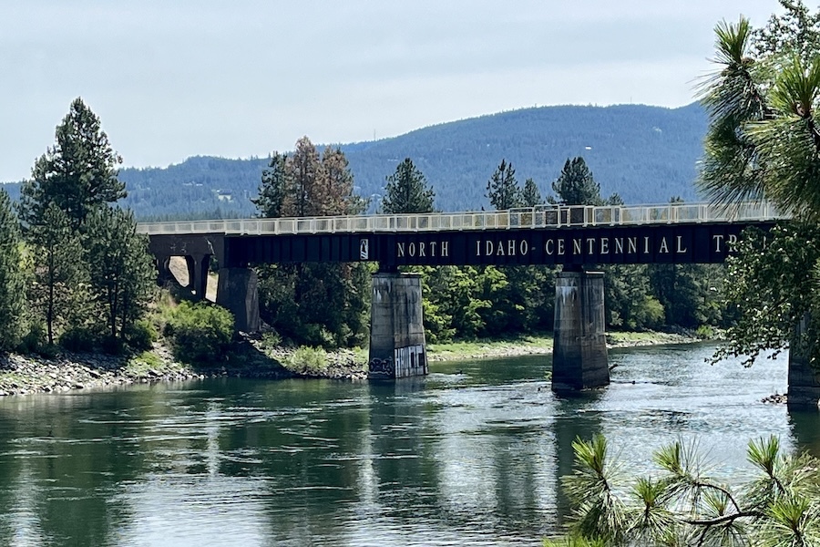 Approaching the Washington/Idaho state line on the eastern portion of the Spokane River trail, a bridge marks the start of the connecting North Idaho Centennial Trail. Photo by Cindy Barks