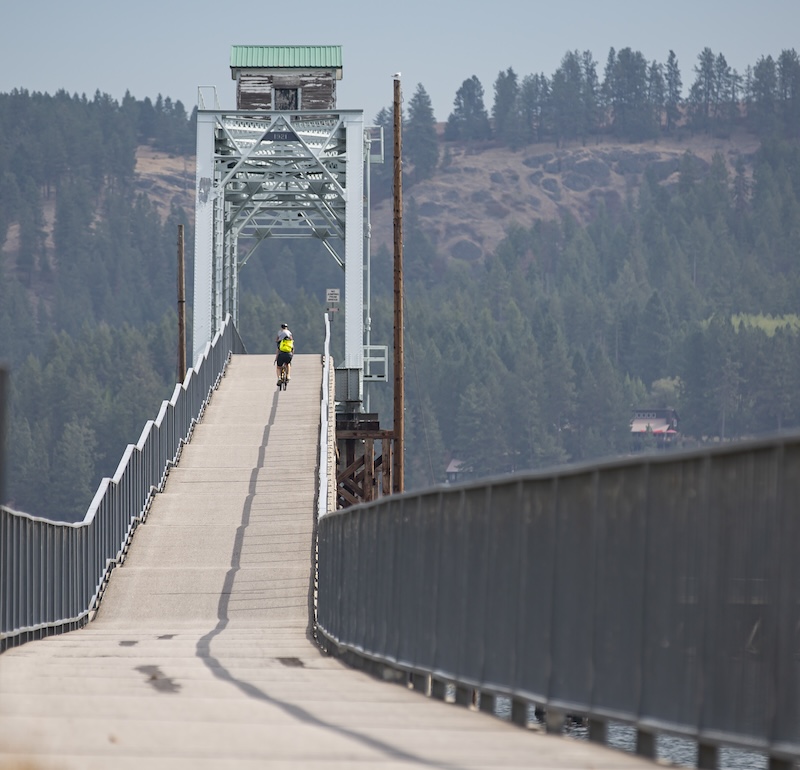 Bicyclists on the Chatcolet Bridge on Idaho's Trail of the Coeur d'Alenes | Photo by Glenn Zinkus