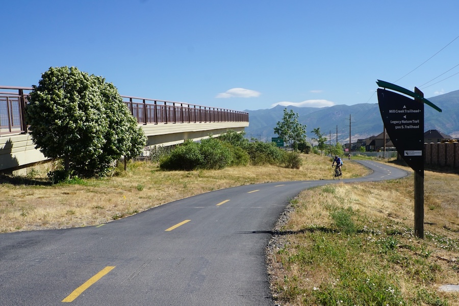 The Legacy Parkway Trail in the Salt Lake City, Utah, area passes through a variety of neighborhoods. In Farmington, it runs along a freeway and a railroad track, as well as a transit stop and a busy shopping area. | Photo by Cindy Barks