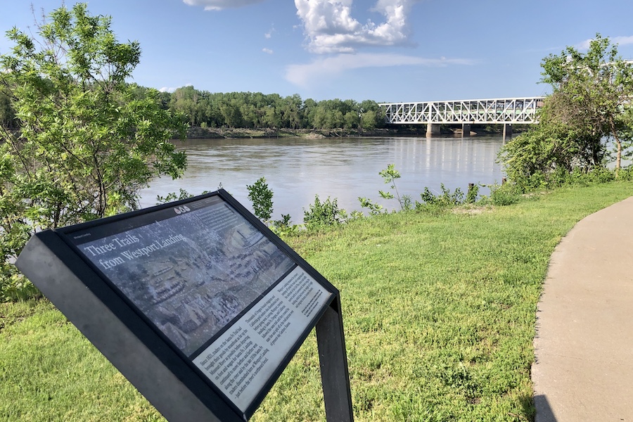 In Berkley Riverfront Park, the “Three Trails from Westport Landing” interpretive sign tells the story of the traders on the Santa Fe Trail who brought their goods by steamboat as far up the Missouri River as possible before departing on foot and wagon for Santa Fe. By the late 1830s, the traders were disembarking at this site, called Westport Landing. | Photo by Cindy Barks