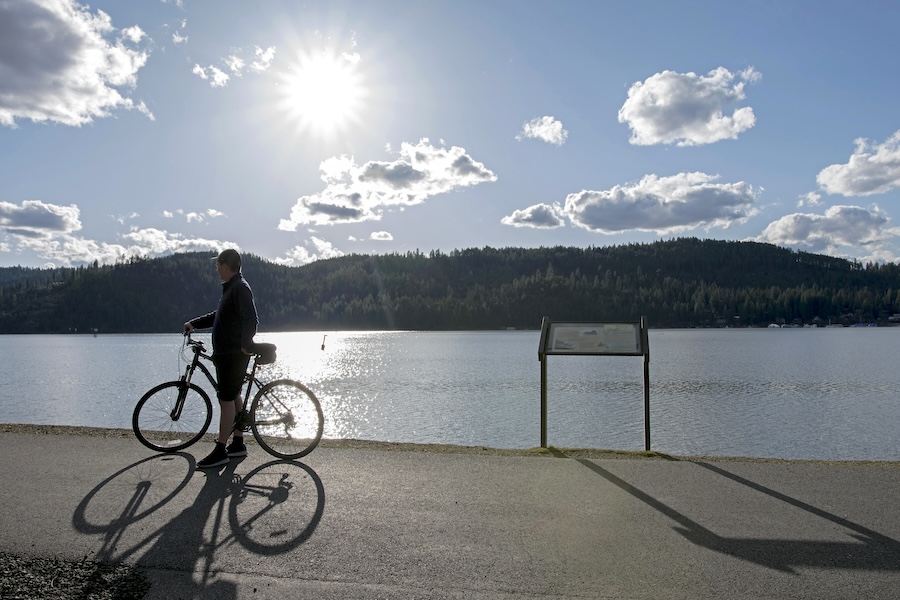 Spanning 73 miles across the state’s panhandle, the Trail of the Coeur d’Alenes traces wooded lake shores and the Coeur d’Alene River. | Photo by Lisa James