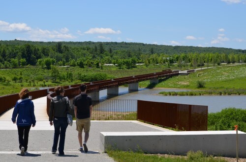Debby Borza (left) leads visitors along a footpath near the Flight 93 memorial, where 40 people lost their lives during the September 11, 2001, attacks. Borza’s 20-year old daughter Deora Bodley was one of the passengers. | Photo by Charlie Rossi