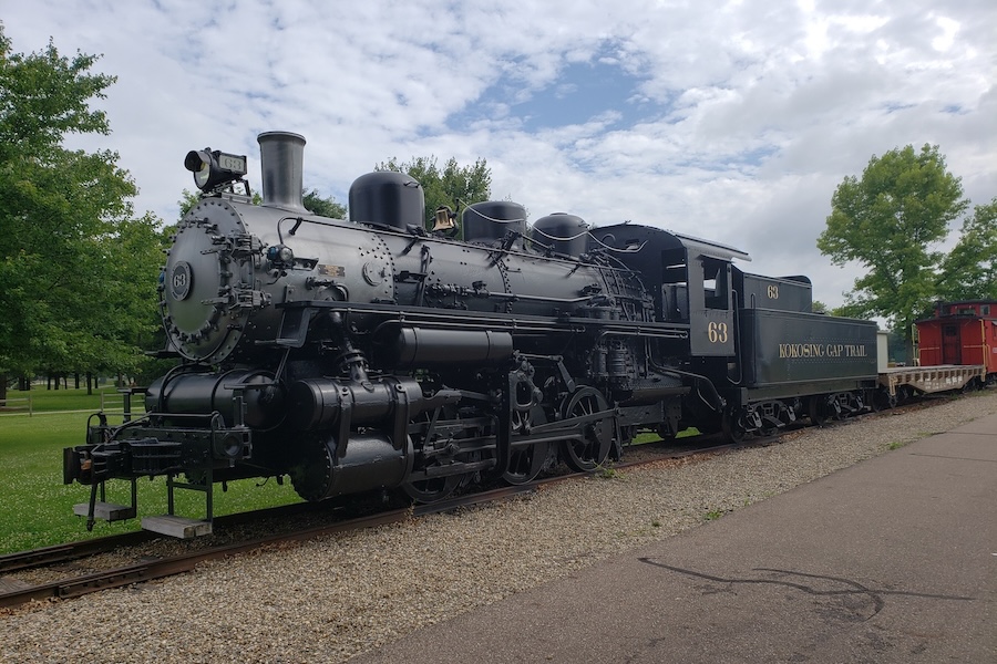 “Day 3 was a wonderful 68-mile ride from Danville to Columbus,” said Oberg, who had organized the logistics of the trip. “From Danville, we were on the Kokosing Gap Trail. This was a wonderful trail, with some great river views and a superb trailhead in Gambier, complete with a train locomotive and cars to see.” Kokosing Gap Trail in Gambier | Photo by Eli Griffen