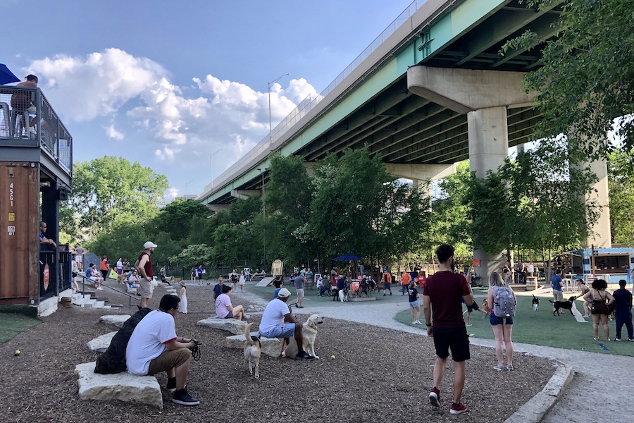 Dog owners flock to the Riverfront Heritage Trail, in part because of the proximity of Bar K, a unique business just steps from the trail that features a combination of a modern bar, restaurant, event space and dog park. | Photo by Cindy Barks