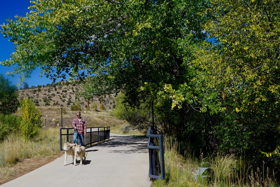 Durango resident Sam King out with his two Siberian huskies | Photo by Cindy Banks