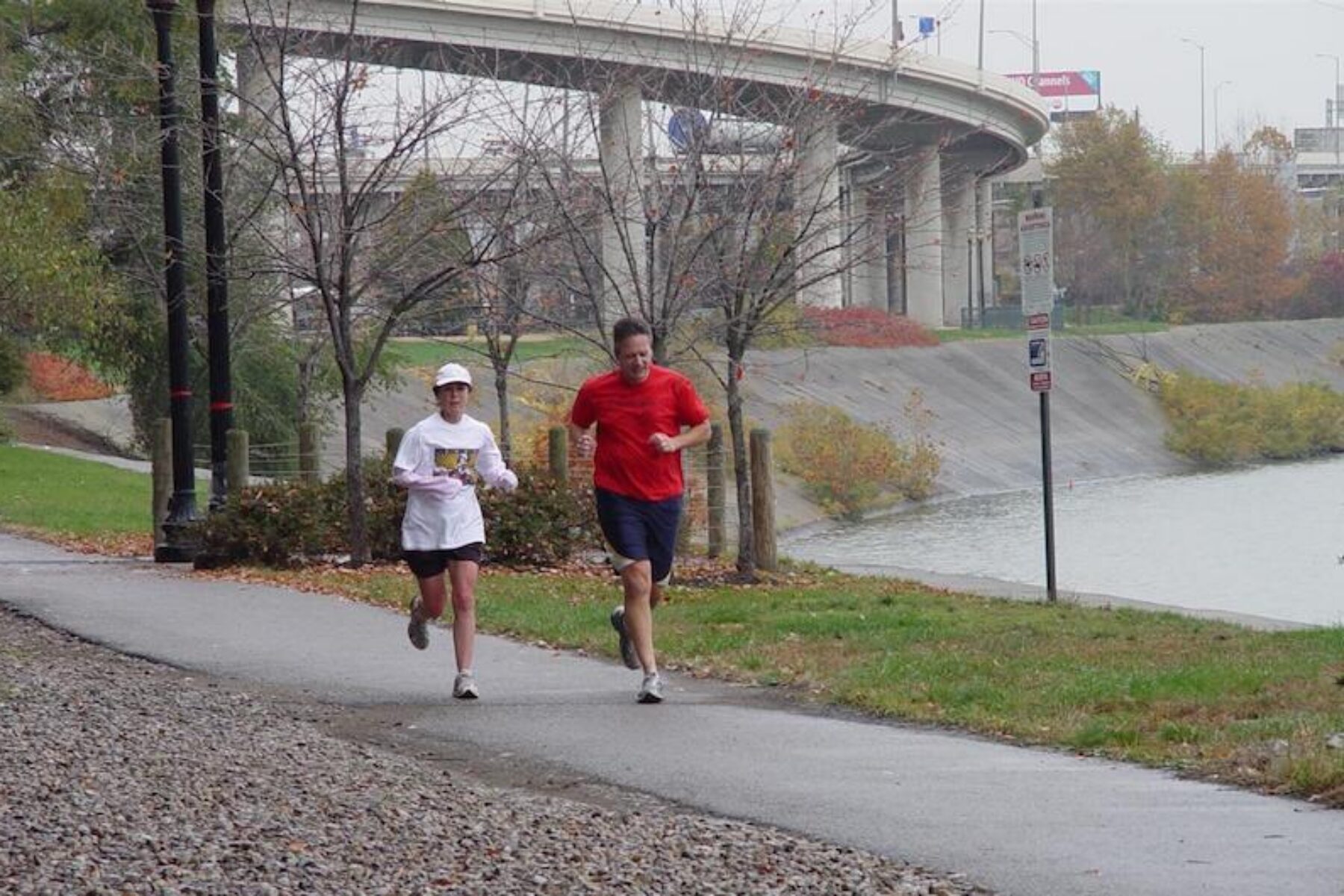 People jogging along the Louisville Loop Riverwalk | Courtesy of Louisville Parks and Recreation