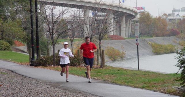 People jogging along the Louisville Loop Riverwalk | Courtesy of Louisville Parks and Recreation