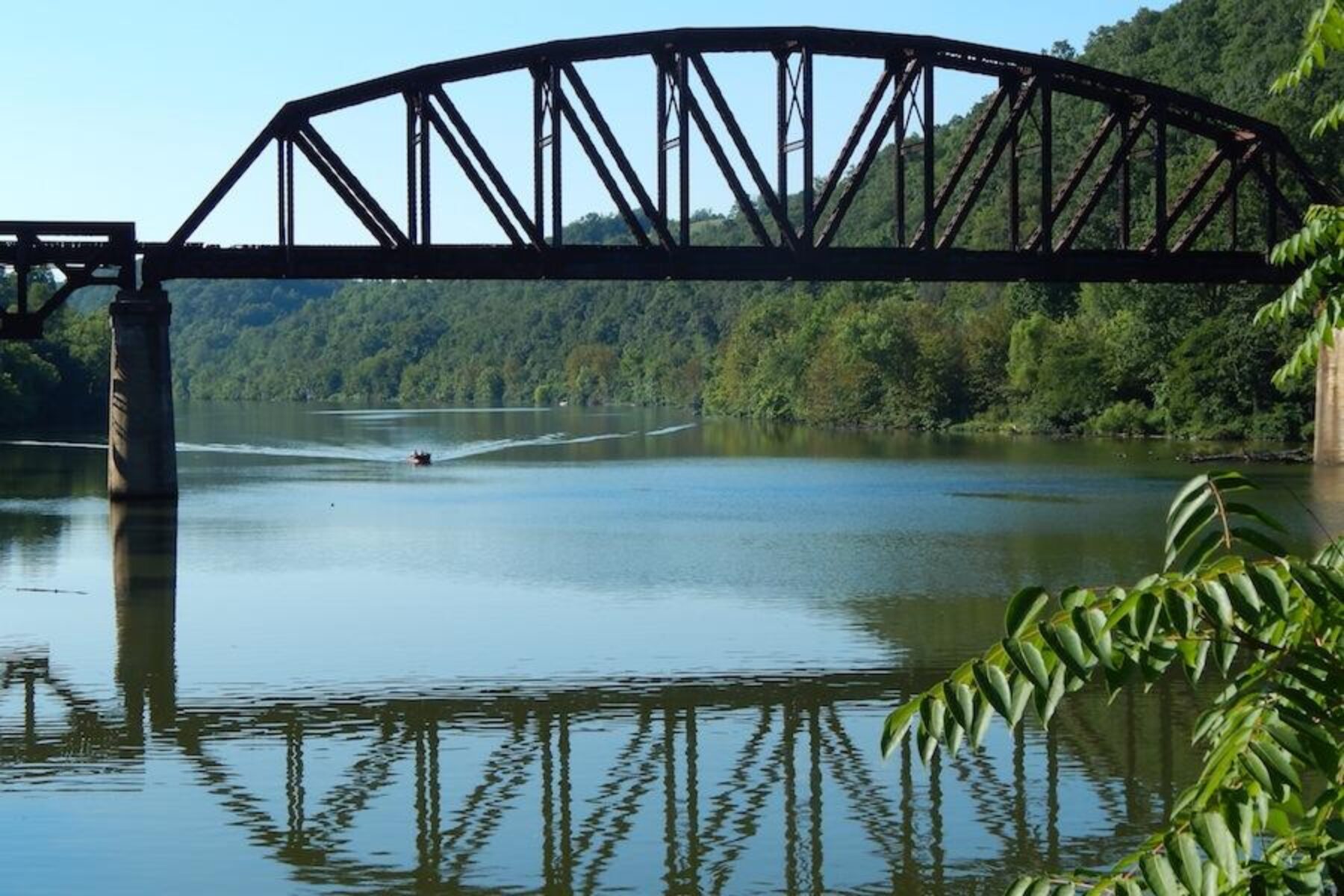 Railroad bridge crossing the Mon River seen from the Mon River Trail | Photo by Ella Belling