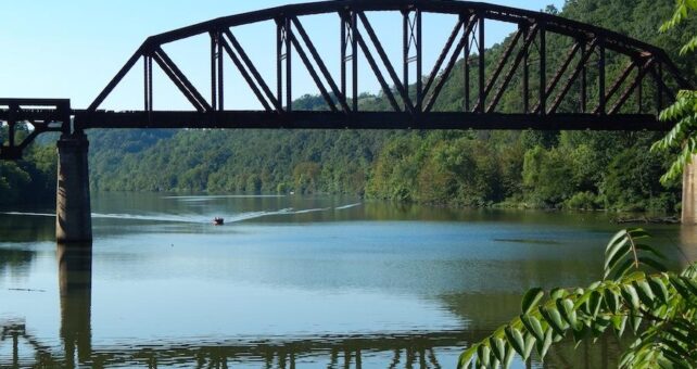 Railroad bridge crossing the Mon River seen from the Mon River Trail | Photo by Ella Belling