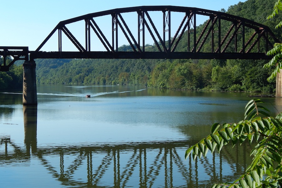 Railroad bridge crossing the Mon River seen from the Mon River Trail | Photo by Ella Belling