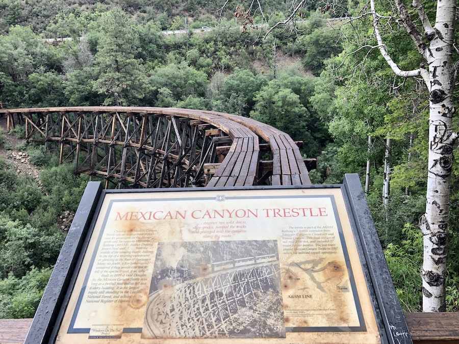 A sign at the base of the Cloud-Climbing Trestle notes that crossing the original structure was an unforgettable experience for passengers on the Alamogordo and Sacramento Mountain Railway (A&SM). Today, a network of trails takes hikers to the base of the trestle, but walking onto the trestle is prohibited. | Photo by Cindy Barks