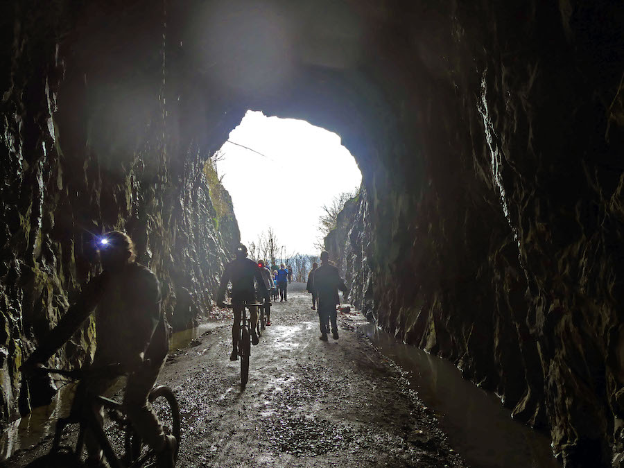 A group of cyclists enter the Blue Ridge Tunnel from its eastern end. | Photo by Nancy Sorrells