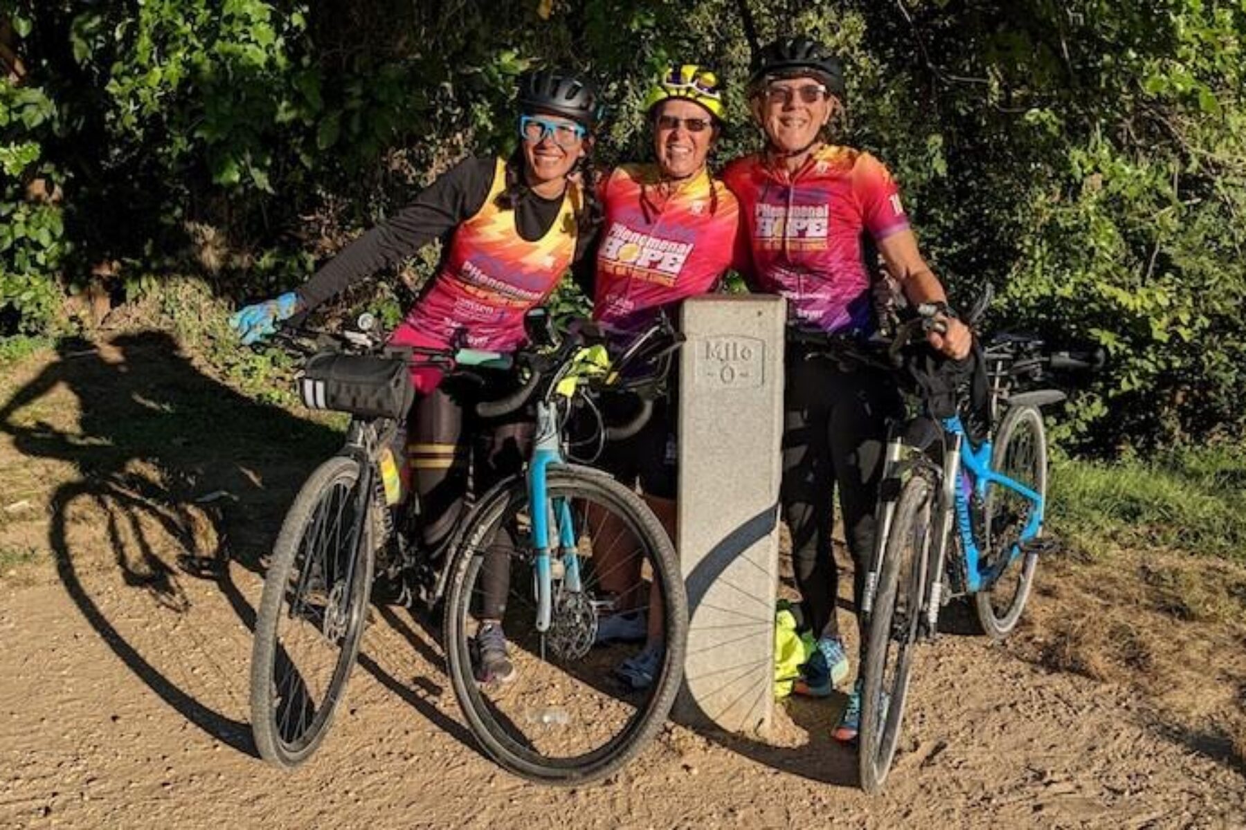 Betzy Salcedo, Brenda Hamilton and Kathleen Richardson at the end of a ride from Pittsburgh to Washington, D.C., via the Great Allegheny Passage and C&O Canal Towpath. | Photo by Joseph Richardson