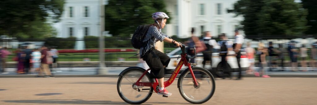 Bicyclist in front of the White House | Photo courtesy Getty Images