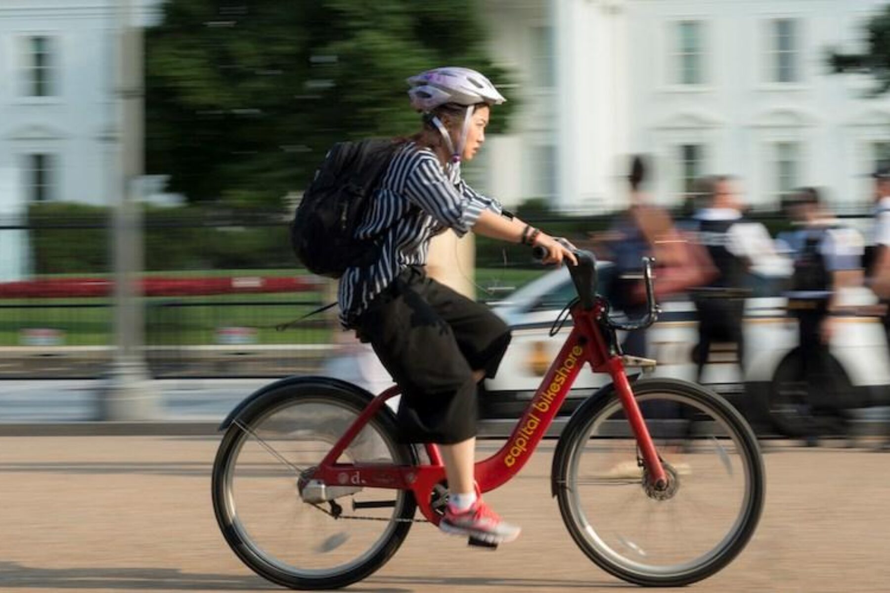 Bicyclist in front of the White House | Photo courtesy Getty Images
