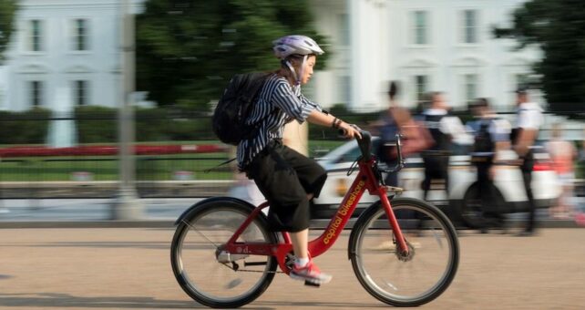 Bicyclist in front of the White House | Photo courtesy Getty Images