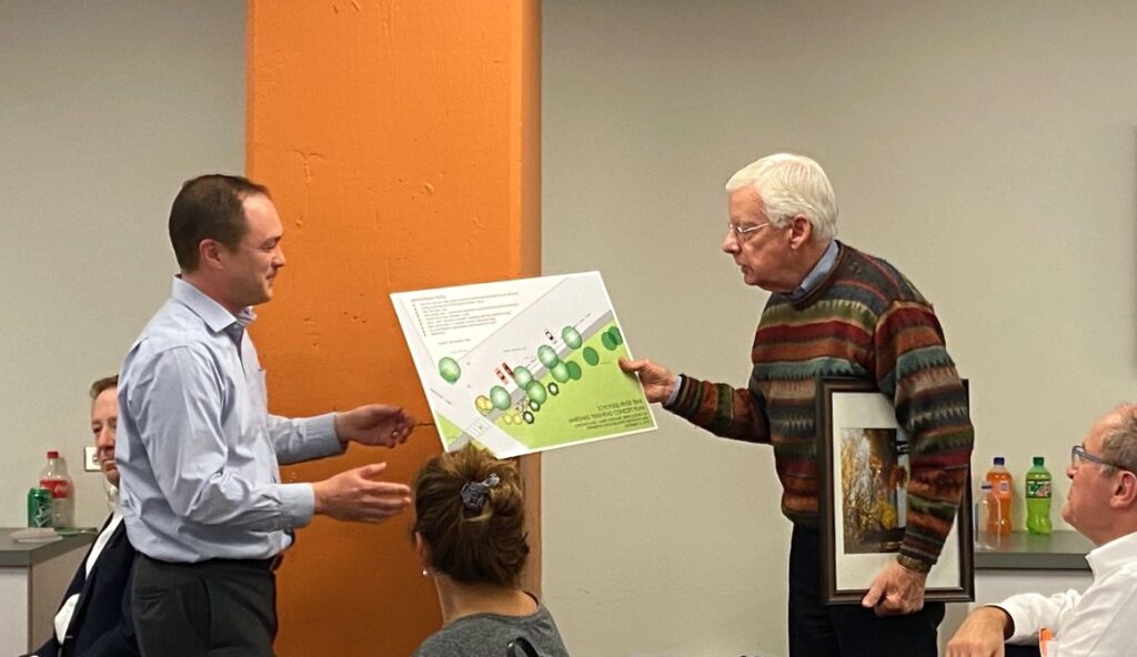 Charlie Marshall receiving a plan of the Marshall Trailhead | Courtesy RTC