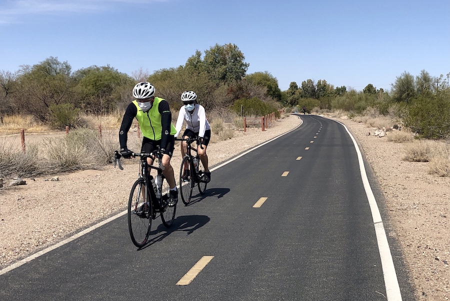 Cyclists on the Santa Cruz River Park Trail in Christopher Columbus Park | Photo by Cindy Barks