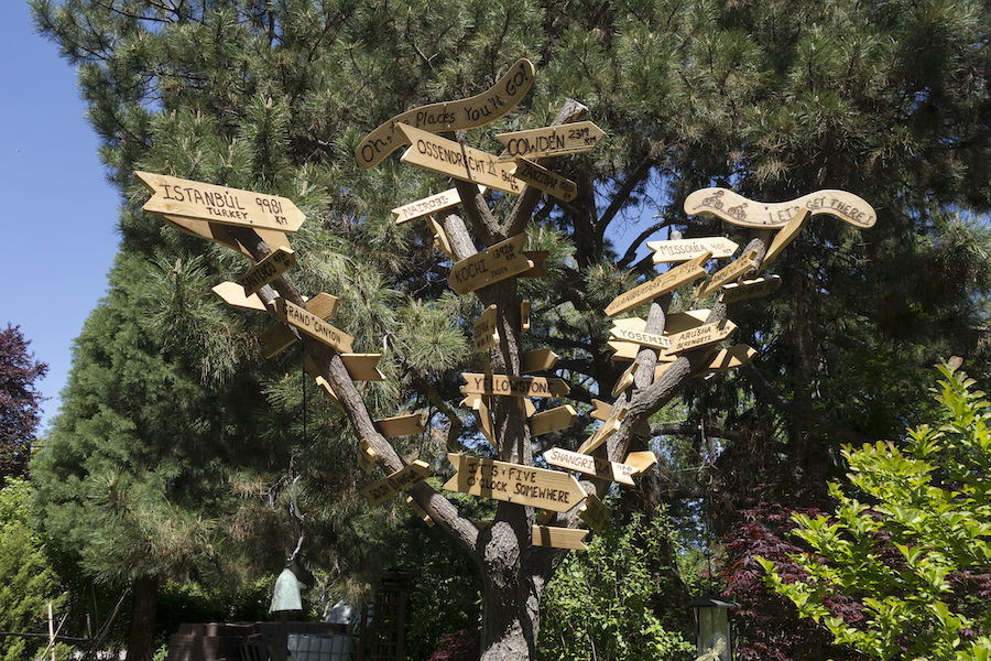 Distance markers in the tree point to places the Hugens have cycled | Courtesy Rachel and Patrick Hugens