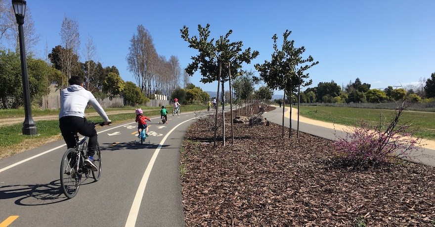 Family riding along California's Cross Alameda Trail through Jean Sweeney Park | Photo by Laura Cohen and Rolf Bell