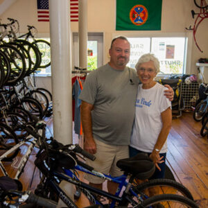 Jerry Camper in his bike shop in Abingdon, Va., with patron and friend Mary Ann Moore whose husband French Moore was a creator of the trail. | Photo by Tyler Evert:AP Images