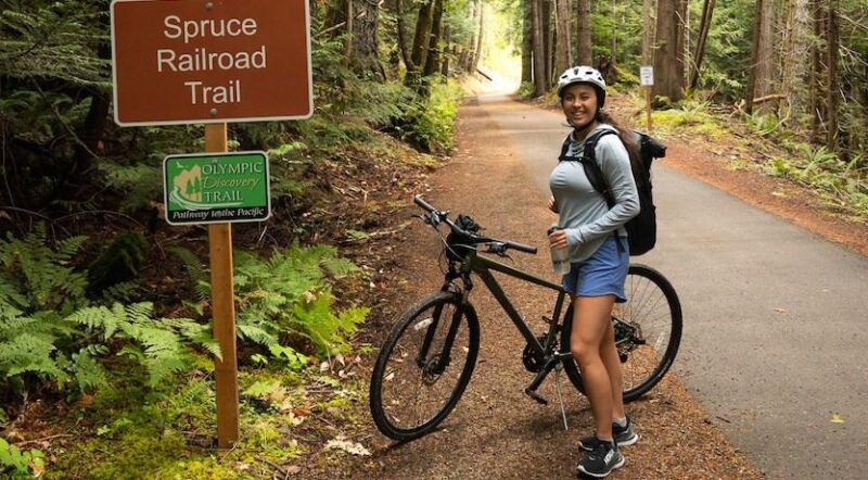Kara Patajo @YourNorthWestieBestie on the Spruce Railraod Trail, part of the Olympic Discovery Trail | Photo courtesy Kara Patajo